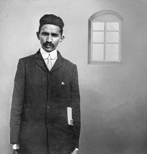 A black-and-white photograph of Gandhi.