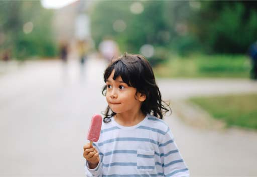 Girl walking whilst eating ice cream