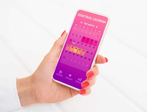 The image shows an app on a smart phone used to track menstrual cycles.