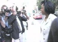 Diana with photographers after winning her court case