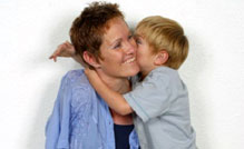 A boy hugging his mum