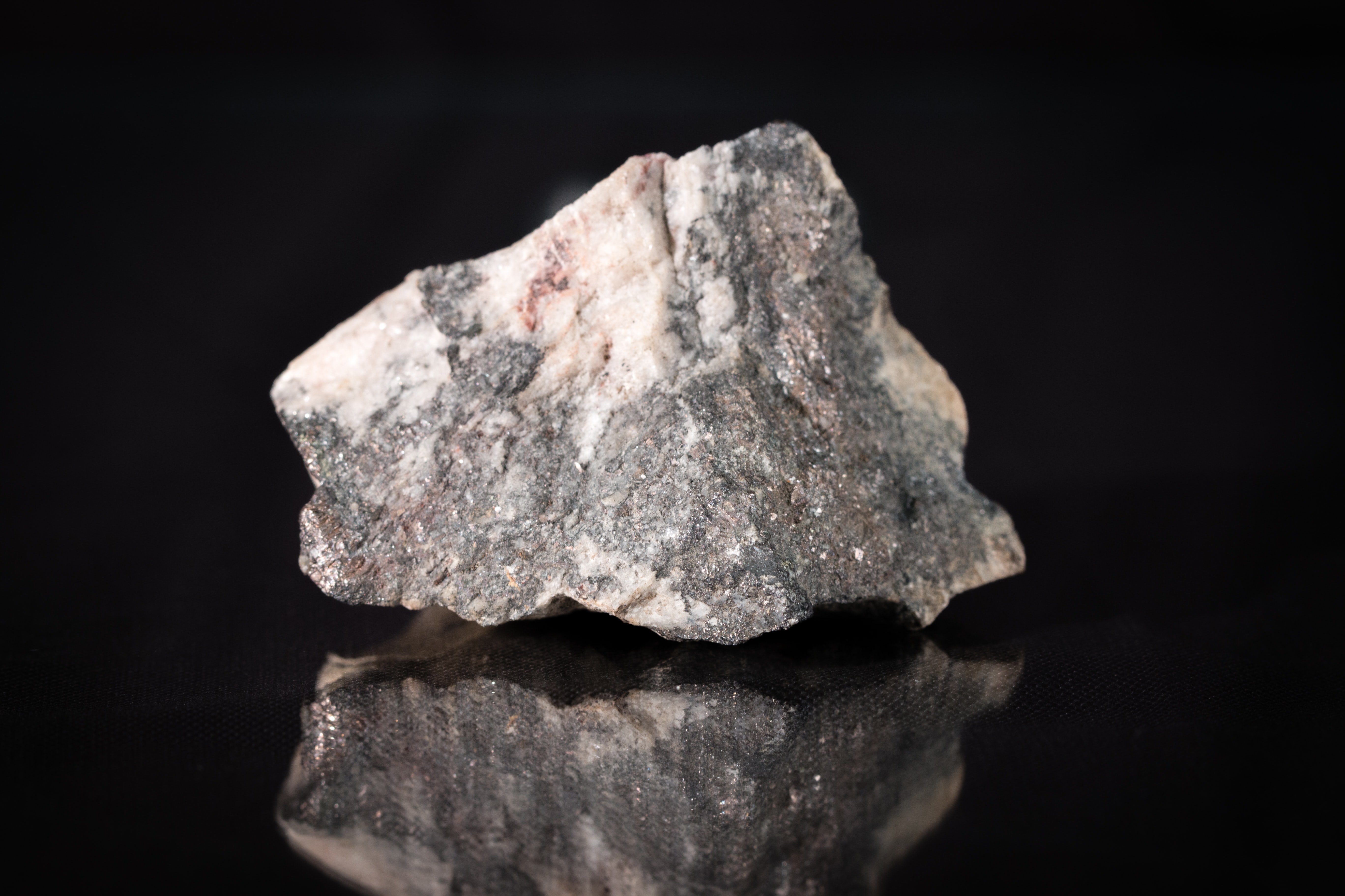A rock against a black background