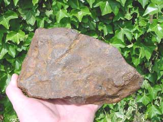 A meteorite showing rust as a result of long exposure to damp inline