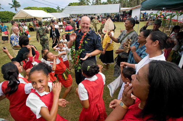  Royal New Zealand Navy Petty Officer Richard Boyd dances with school children during a Pacific Partnership 2009 community service project at Faleloa Primary School