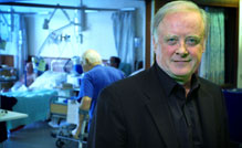 Gerry Robinson standing in hospital ward