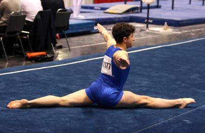 A male gymnast on the floor