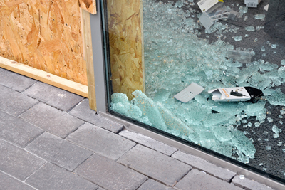 A smashed shop window. It occurred in the Birmingham city centre during the riots of 2011.