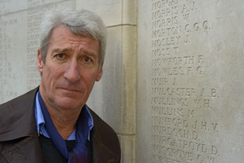 Jeremy Paxman standing next to First World War monument