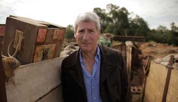 Jeremy Paxman stands in a recreated battlefield trench
