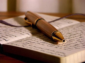 Fountain pen resting on an open journal