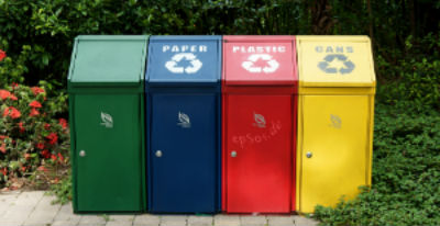 bright recycling bins for plastics, cans and paper