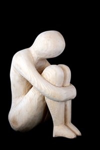 A statue of wood - depressed man or depression symbol