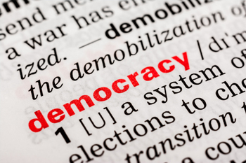 Image of the word 'democracy' in a dictionary. 