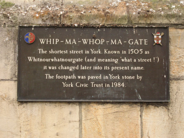 A sign explaining the exotic York street name Whip-ma-whop-ma Gate as being derived from a phrase for 'what a street'