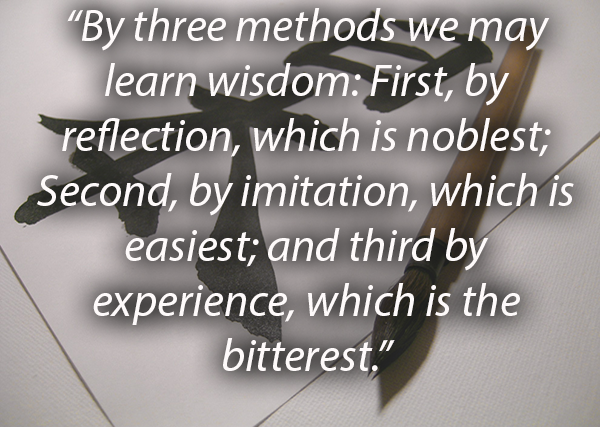 photo of a Chinese calligraphy set with a Confucius quote  "By three methods we may learn wisdom: First, by reflection, which is noblest; Second, by imitation, which is easiest; and third by experience, which is the bitterest."