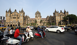 Traffic outside Chhatrapati Shivaji Terminus station, Mumbai on bikes and mopeds