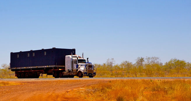 A truck drives through the Big Sandy Desert