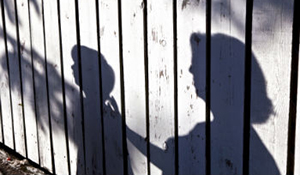 The shadow of a parent and child