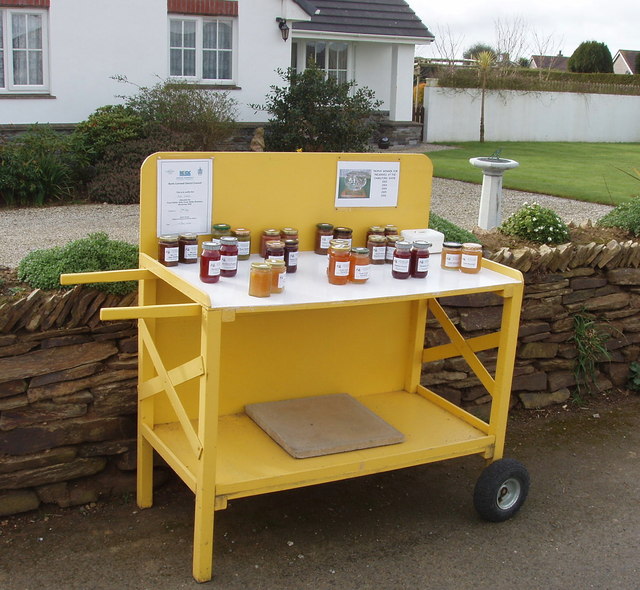An honesty box selling jams and pickles by the side of a road