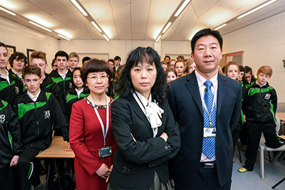 Ms Yang from the BBC Chinese school series with her colleagues and class