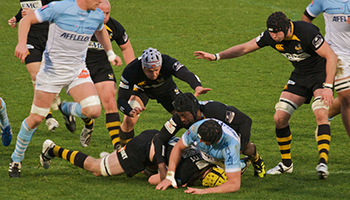 rugby tackle with player on the ground