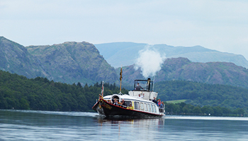 The steam powered gondola yacht on Coniston Lake, Lake District