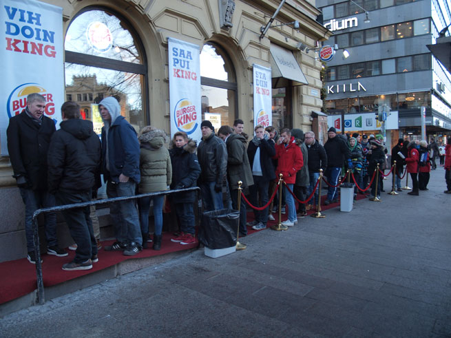 People queue outside the Helsinki Burger King for the meat-based sandwich company's return to Finland in 2013