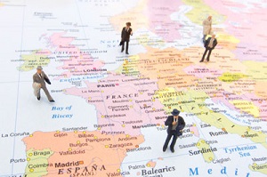 Toy people on a map of Europe