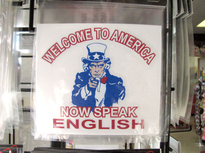 Sign reading 'welcome to America - now speak English'