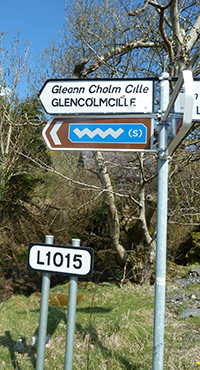 Signpost to Glencolmcille in English and Irish Gaelic