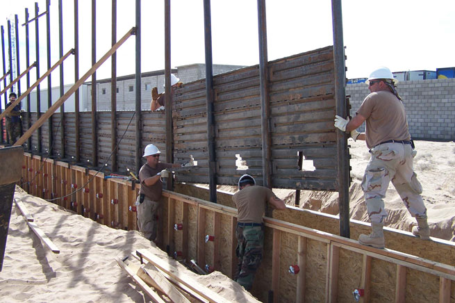 U.S. Air Force airmen install a fence along the U.S.-Mexico border east of San Luis, Ariz., on Oct. 3, 2006. The Guardsmen are working in partnership with the U.S. Border Patrol as part of Operation Jump Start. The airmen are assigned to the 188th Fighter Wing Arkansas Air National Guard. 