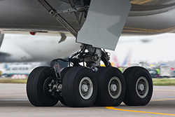 Image of aeroplane landing gear on the runway