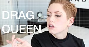 Brendan Jordan posing with the words Drag Queen next to him - taken from YouTube. 