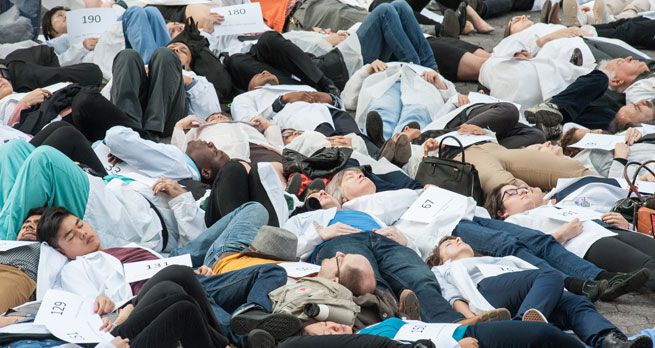 Medics stage a die-in to remember colleagues lost in Syria