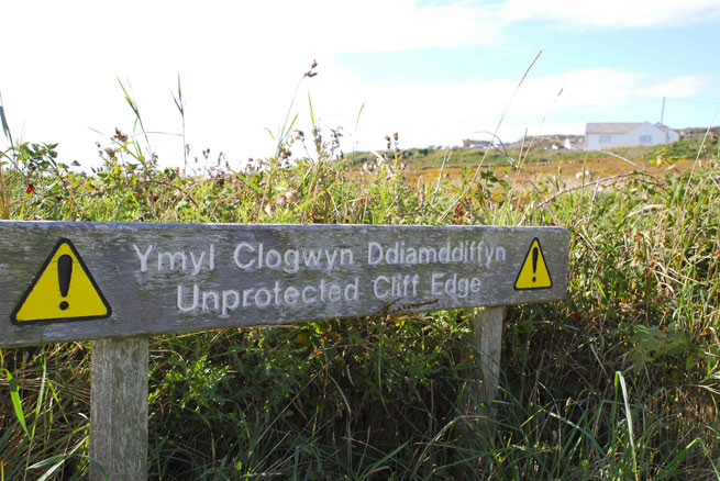 A sign in Holyhead warns in Welsh and English of a sudden cliff edge