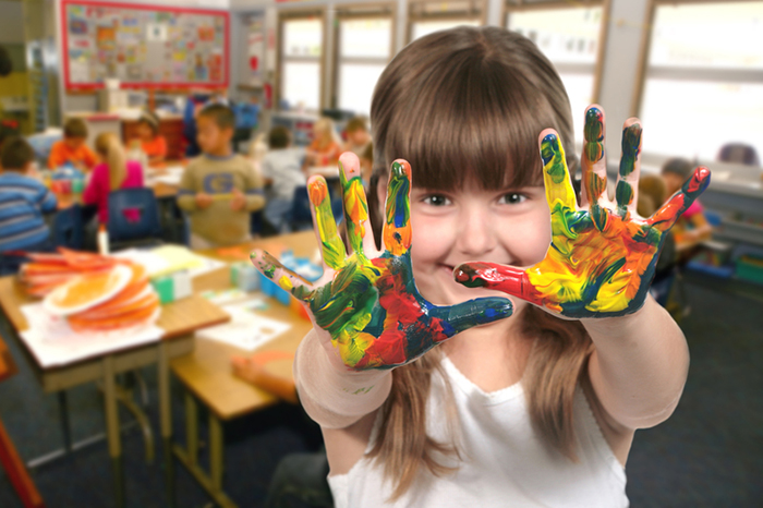 child with paint on her hands