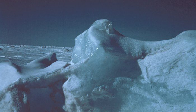 An iceberg caught in pack ice off Alaska