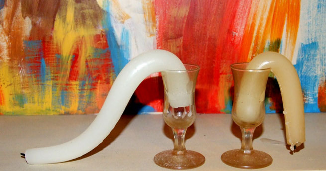 Two candles wilting in extreme heat