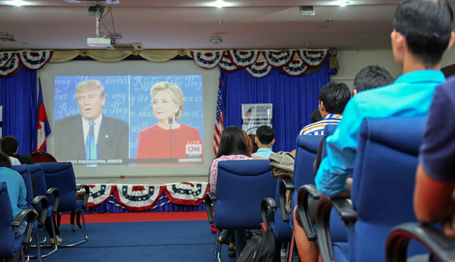 Live viewing party at the U.S. Embassy Phnom Penh, Cambodia, draws an attentive audience for the 1st 2016 Presidential Debate between candidates Hillary Clinton and Donald Trump