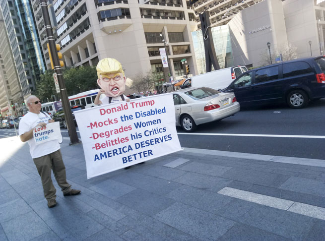A protester in Donald Trump fancy dress