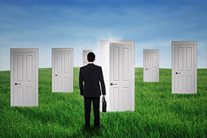 Businessman walking into opportunity doors