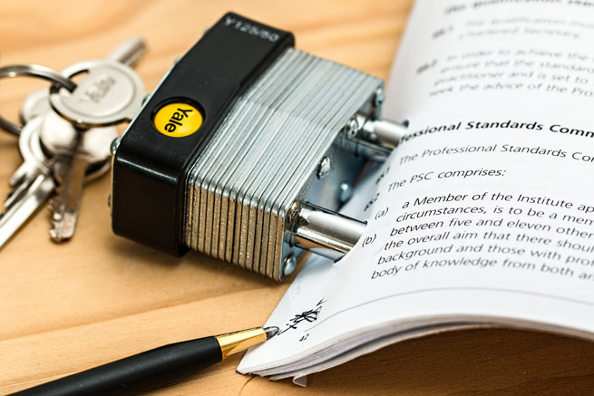 A padlock holds paperwork together