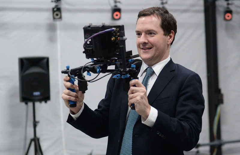 George Osborne looks at a camera