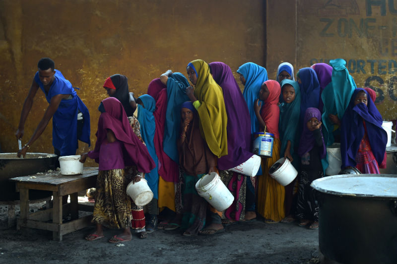 Young girls line up at a feeding centre in Mogadishu, Somalia, on March 9, 2017.