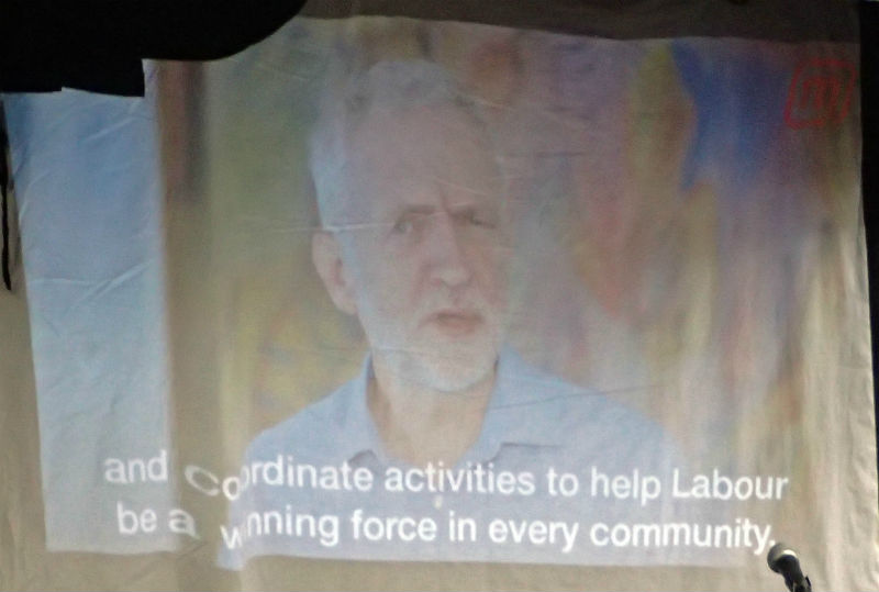 Jeremy Corbyn projected onto a sheet
