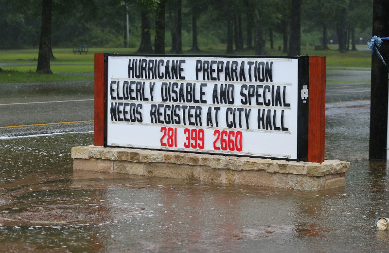 A sign encouraging older people to register before Hurricane Harvey