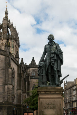 Bronze statue of Adam Smith, a philosopher during the Scottish Enlightenment, in front of St. Giles' Cathedral on the Royal Mile in Edinburgh by Alexander Stoddar.