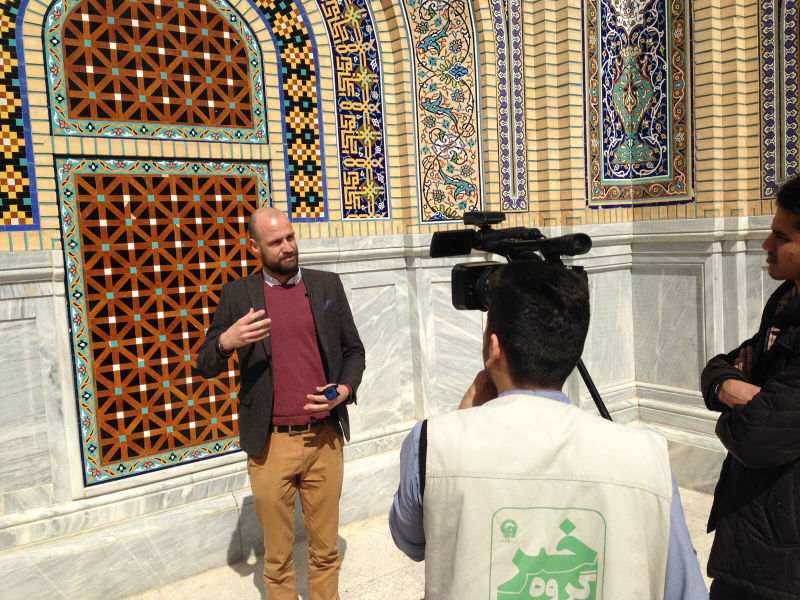 Edward Wastnidge being interviewed at the shrine of Imam Reza in Mashhad, Iran