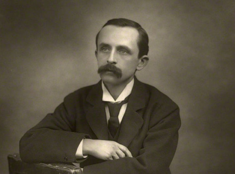 Portrait image of British writer, J.M. Barrie, in black and white 