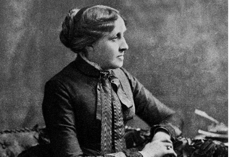 Portrait image of American writer, Louisa May Alcott, in black and white